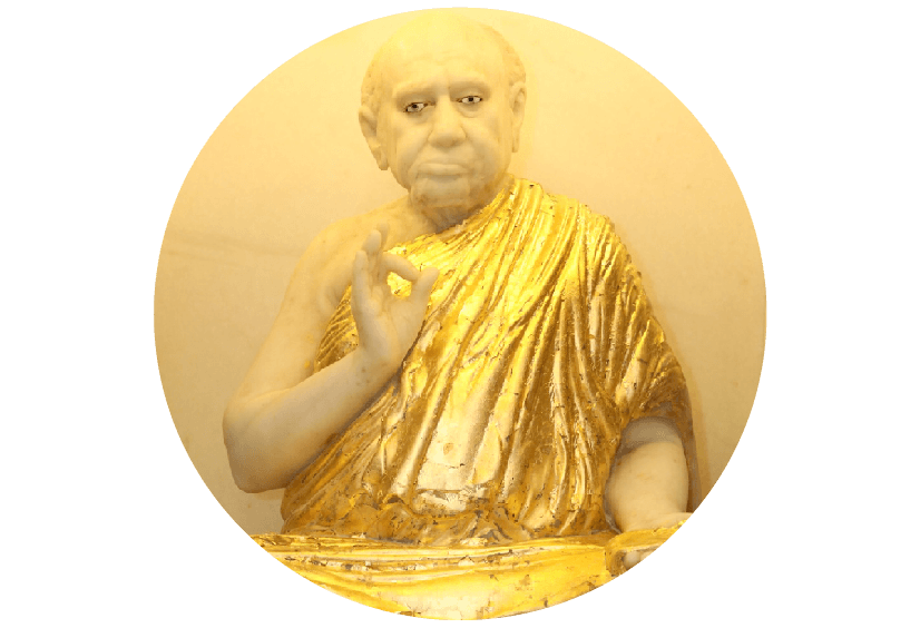 A portrait of a Bapji Maharaj statue.